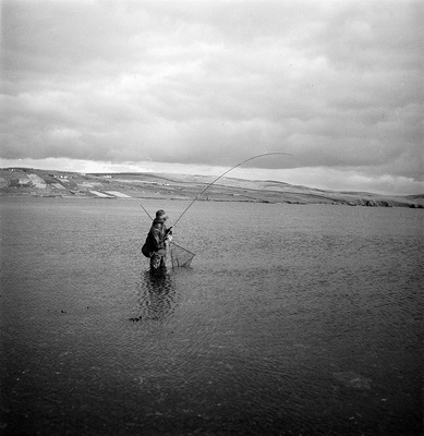  An angler fishing for sea trout at Maraness, Voe of Browland